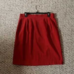 Knee length red pencil skirt.